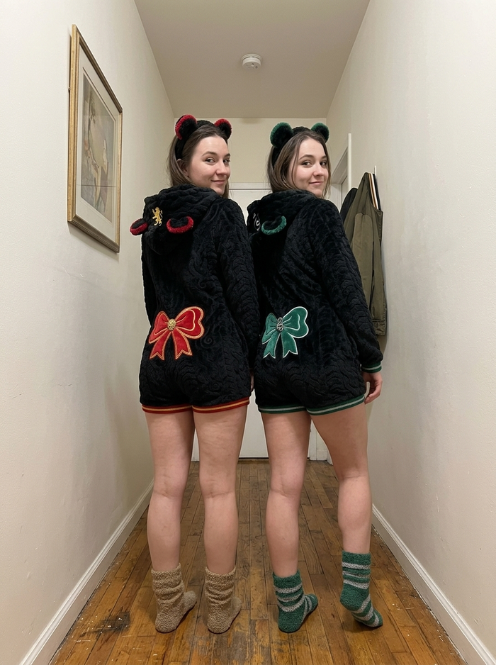 Best friends back to back showing their bows