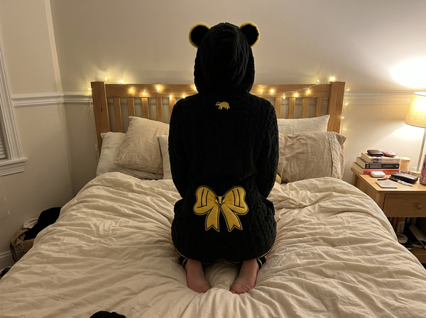Yellow bow on the back of the romper